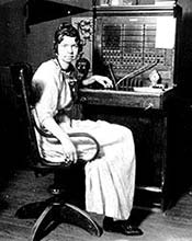 Early local telephone switchboard and operator.